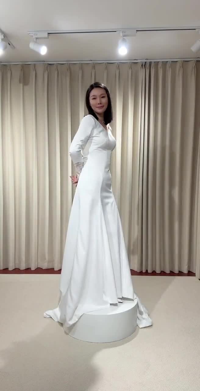 wedding dress from twilight movie Long Sleeve Satin with Lace Back Color:Pale Iris bella's wedding dress twilight Silhouette: Fitted sheath mini silhouette with an asymmetrical ruffled hem Wednesday Addams Dresses |