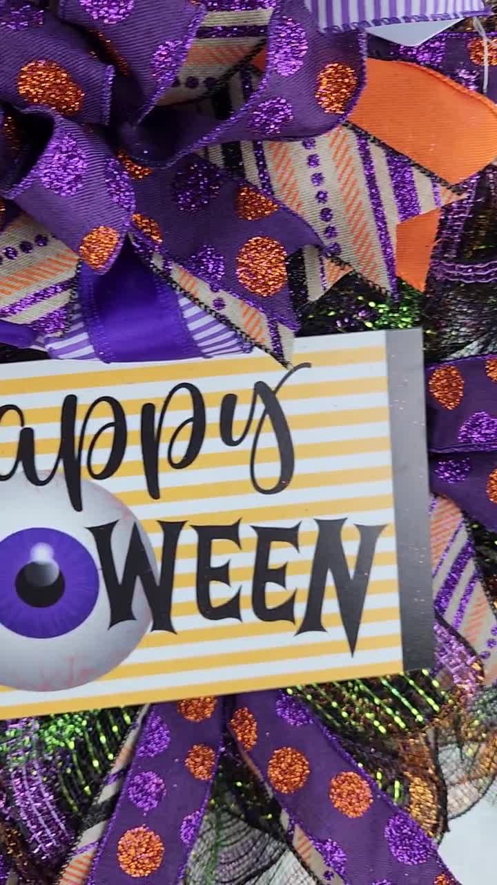 紫とオレンジのリボンが付いたハッピーハロウィンリース、お祭りの目玉