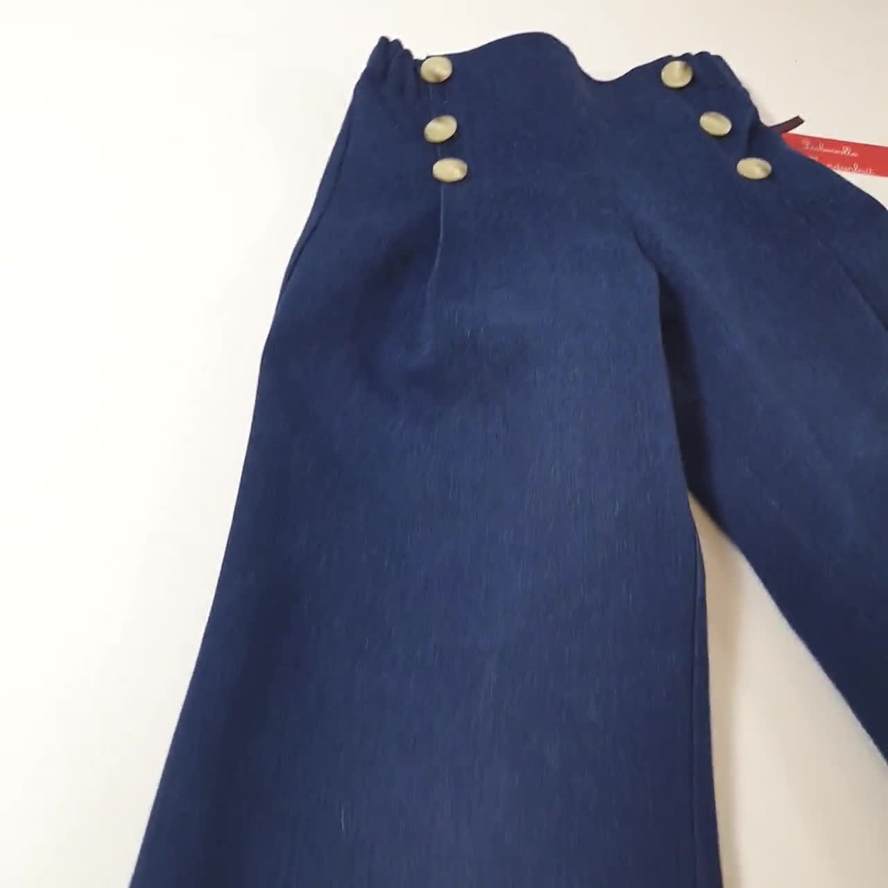 Pantalón vaquero infantil, vaqueros marineros confeccionados en denim de algodón azul oscuro para niño y niña. video poster