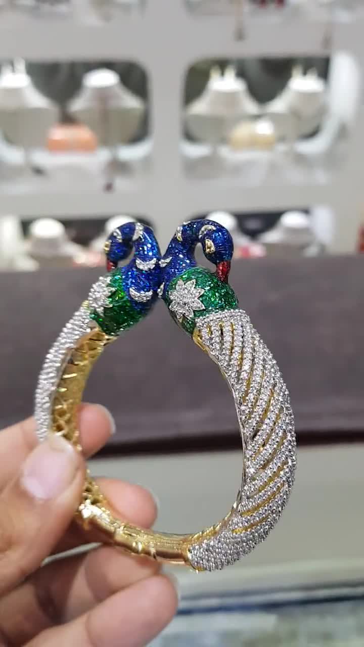 Sold at Auction: 14k Gold and Enamel 4 Strand Peacock Bracelet