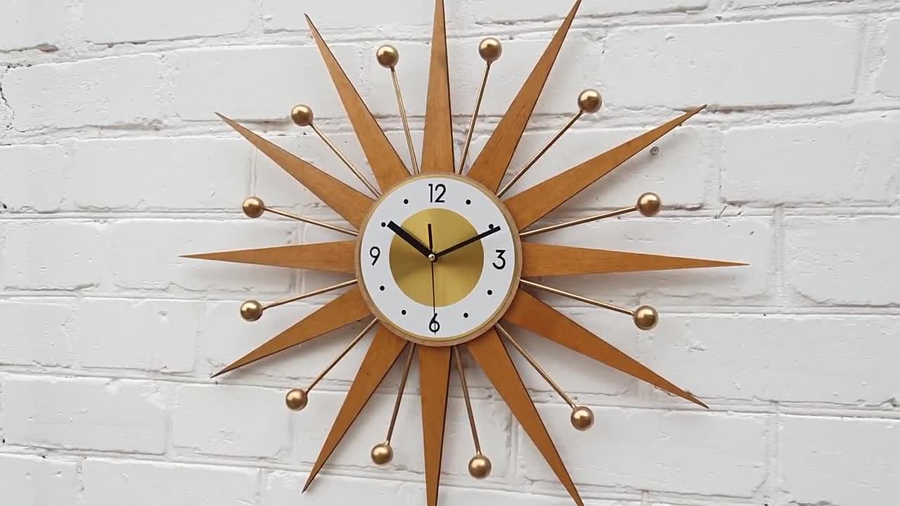 ゴールドサンバースト壁掛け時計 ミッドセンチュリーモダン、レトロな