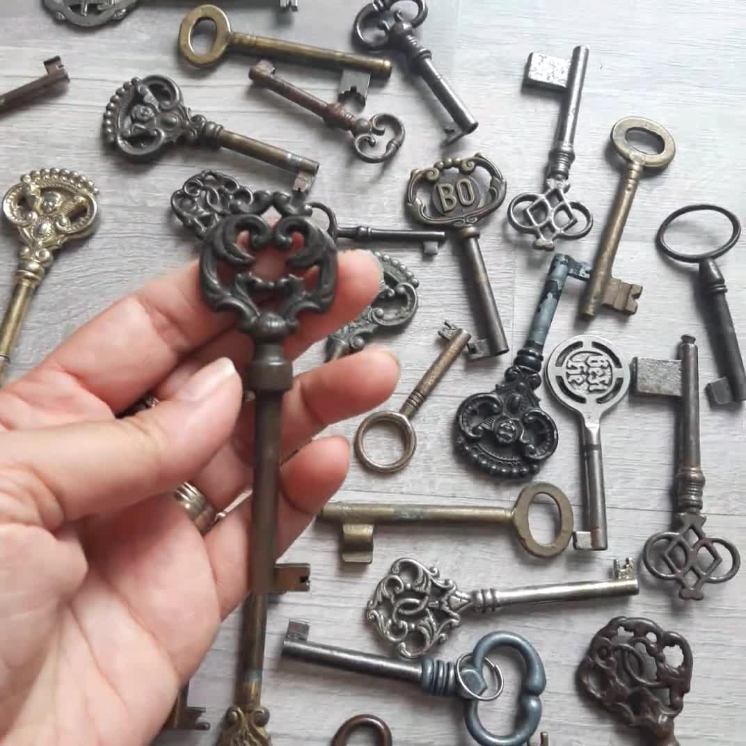 Vintage keys. Antique ornamental safe key, old and modern keys