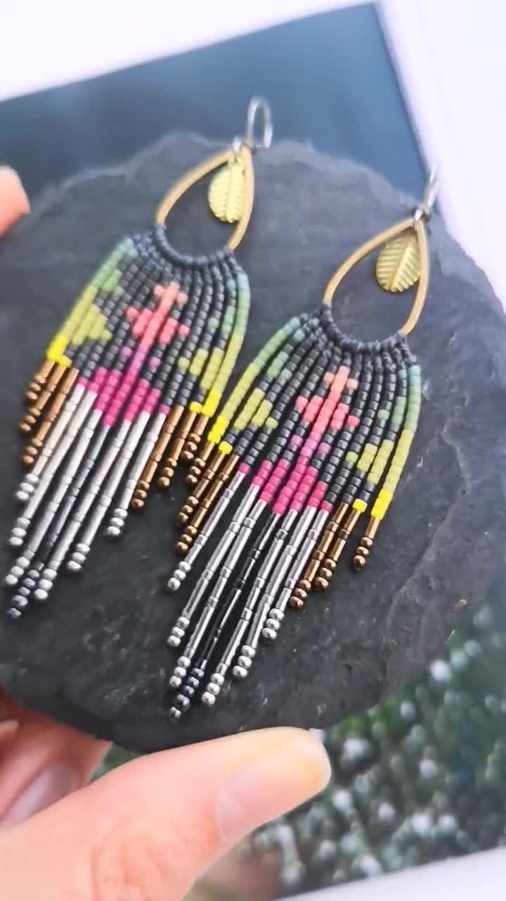 Gold-colored swirl earrings by artisanat-afro - Hanging drops