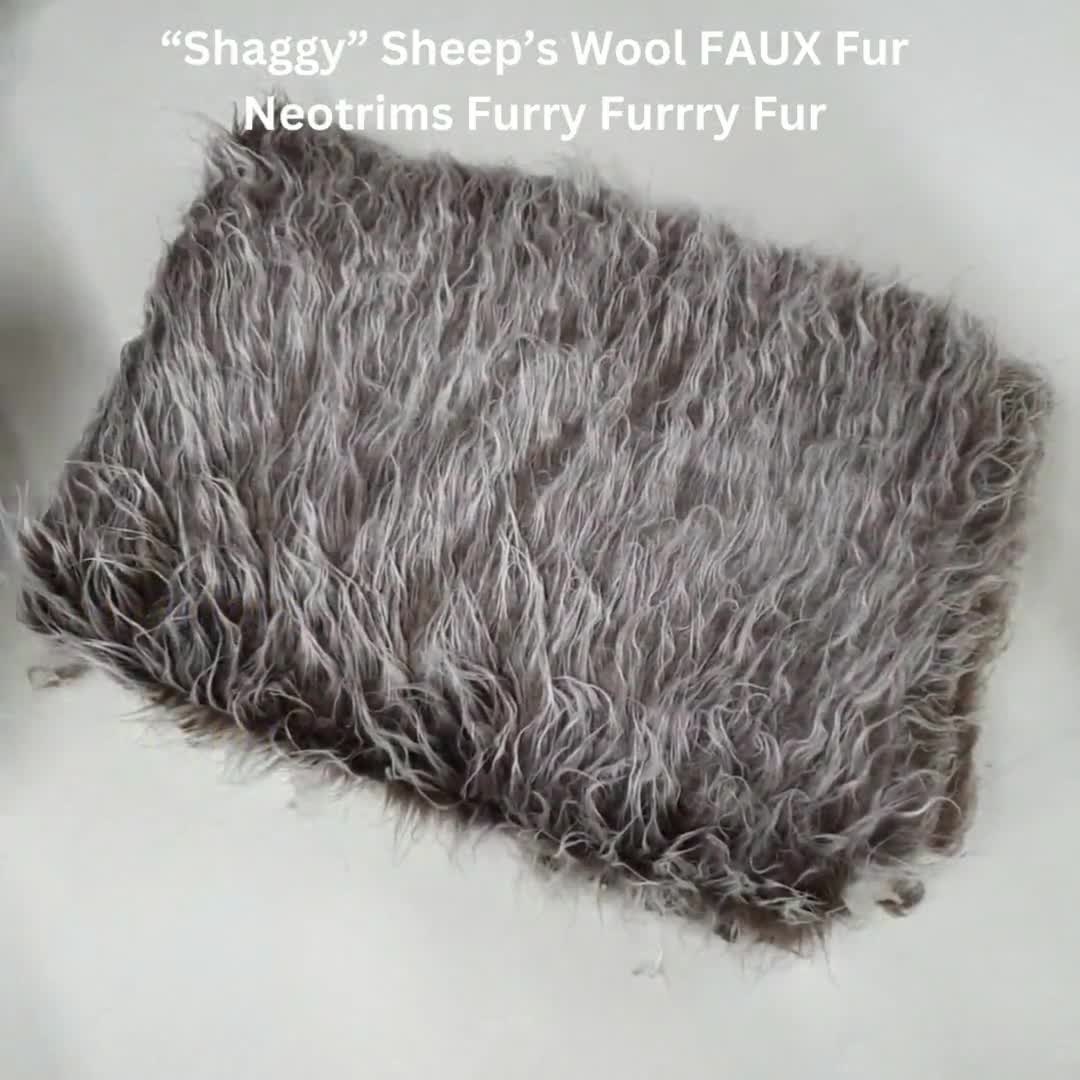 Soft, thick, long-haired, light taupe brown faux fur fabric 