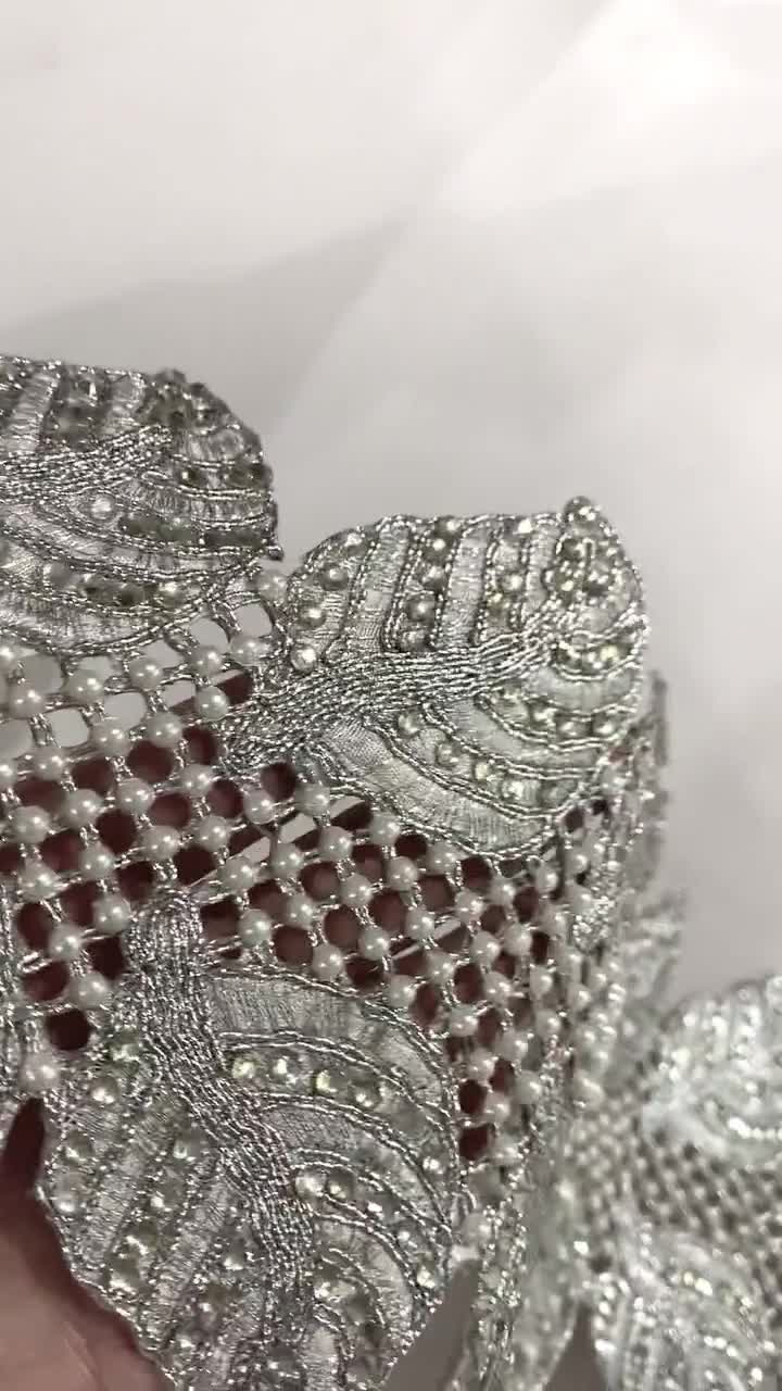 Trimming. Wide border of metallic silver lace in all-over small scale  repeated diamond shape, divided at intervals with a stripe. Outer edge is  scalloped Stock Photo - Alamy