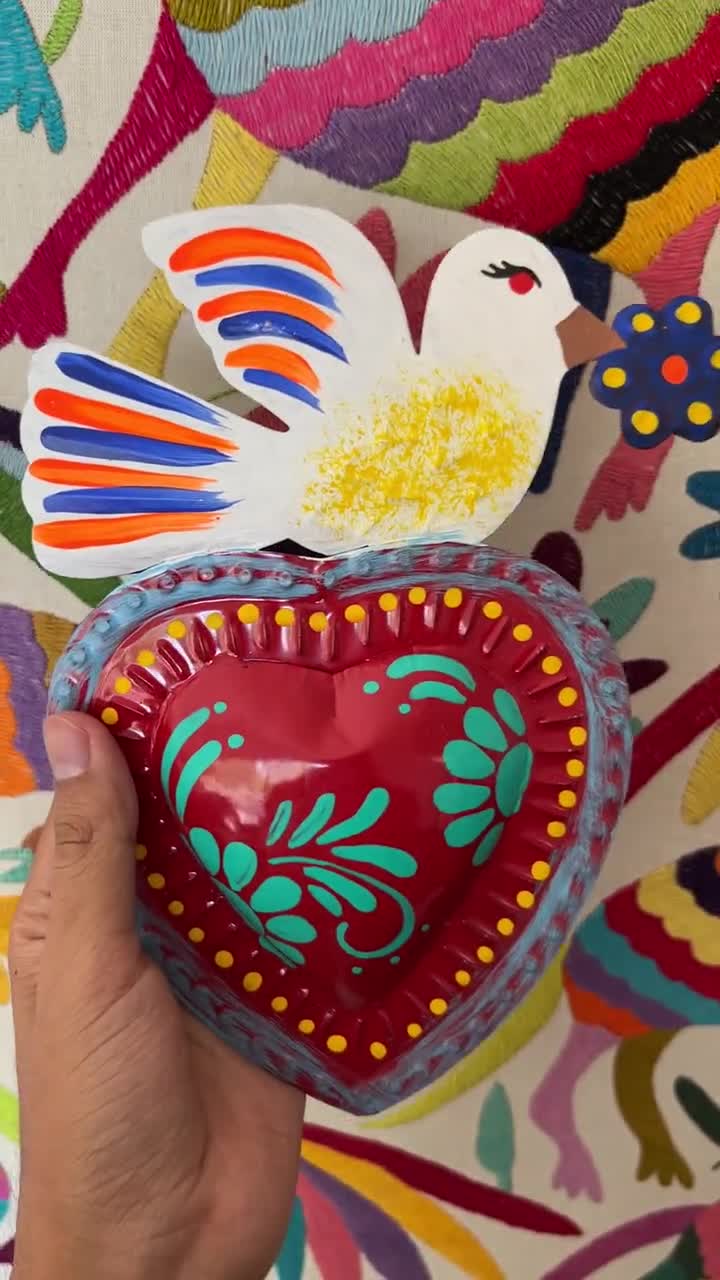 i made a little mexican folk/tin art inspired sacred heart mirror! All i  bought for this was the sheet of tin and had a couple of these small craft  mirrors already. swipe