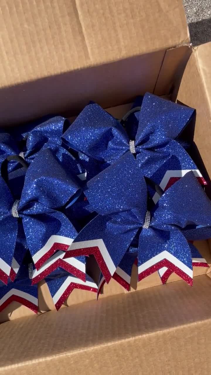 Royal Blue Glitter Cheerleader Bow With Red/white Tails. 