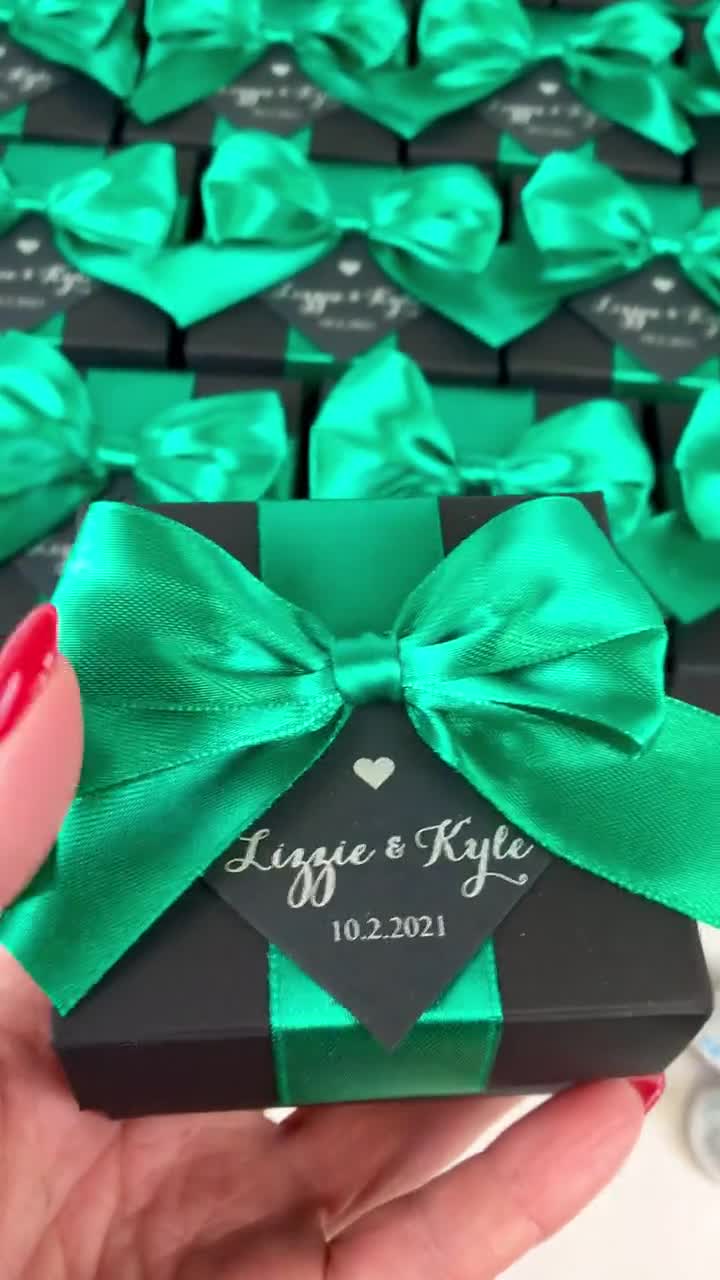 Luxury black gift boxes with green ribbon Stock Photo by bondarillia