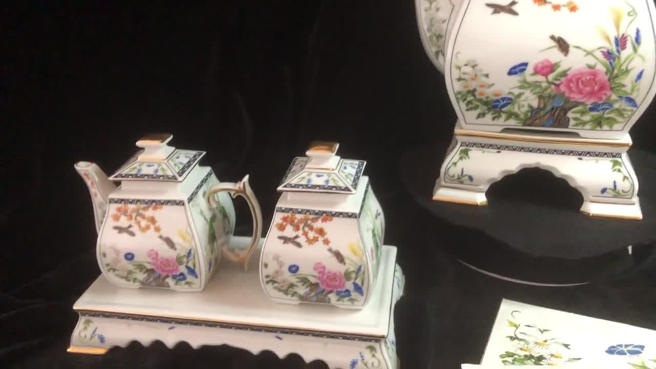 Porcelain Tea Set With Tea Pot, Creamer and Sugar Bowl. the