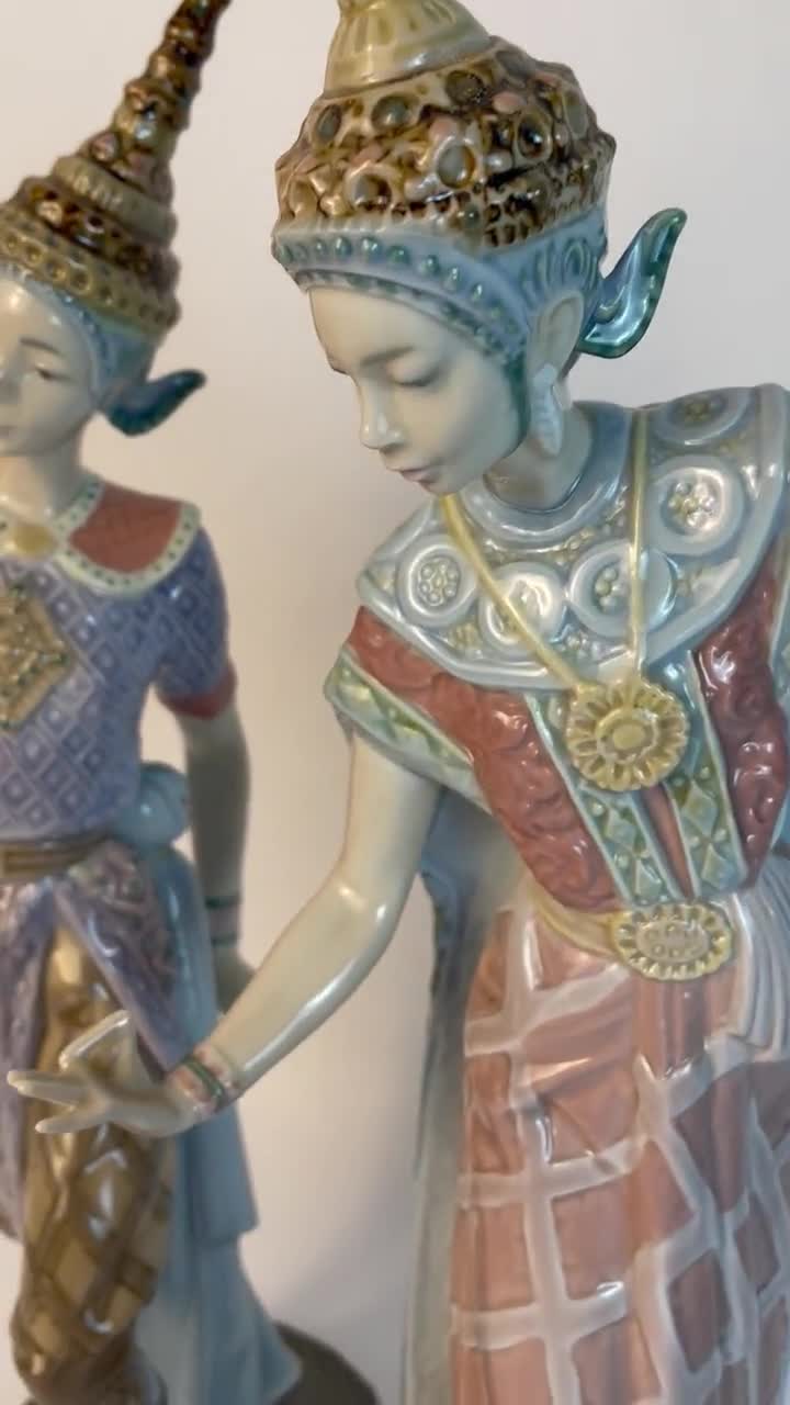 At Auction: Three Porcelain Lladro Figures, to include Closing Scene,  Thai Dancing Couple, and Merry Ballet, tallest 21 inches
