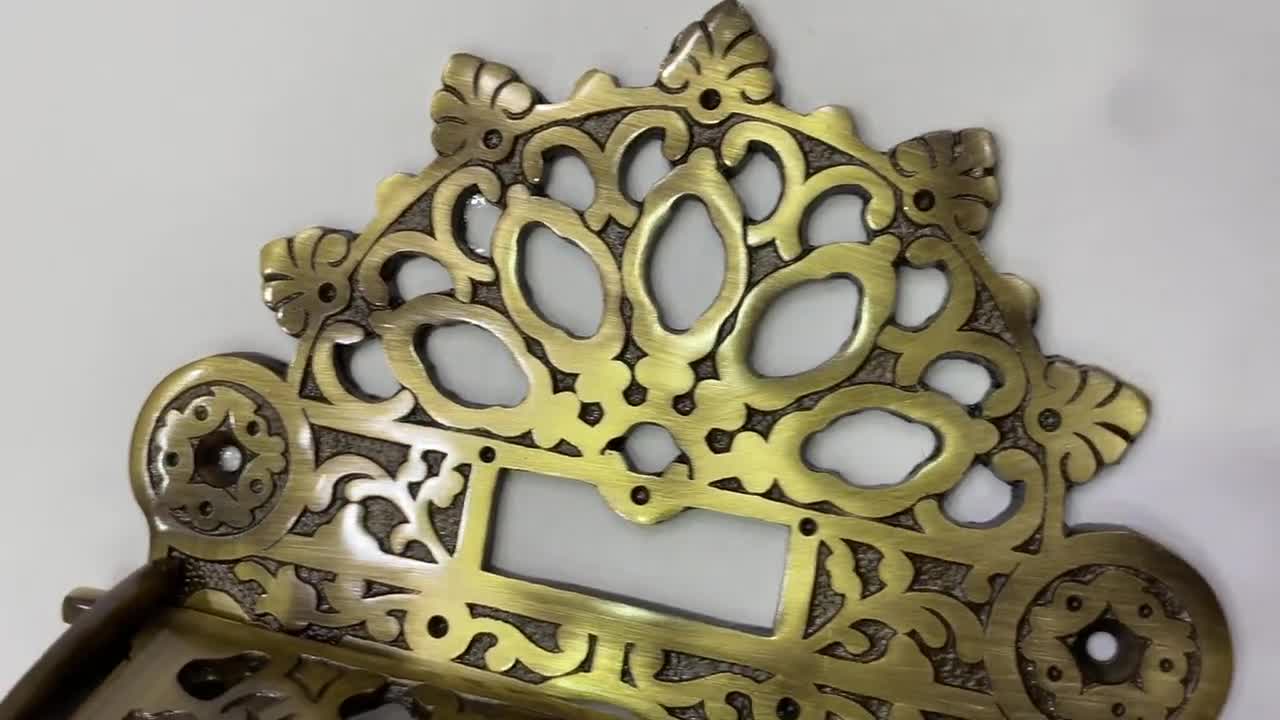 Brass crown antique design wall mounted toilet roll holder.