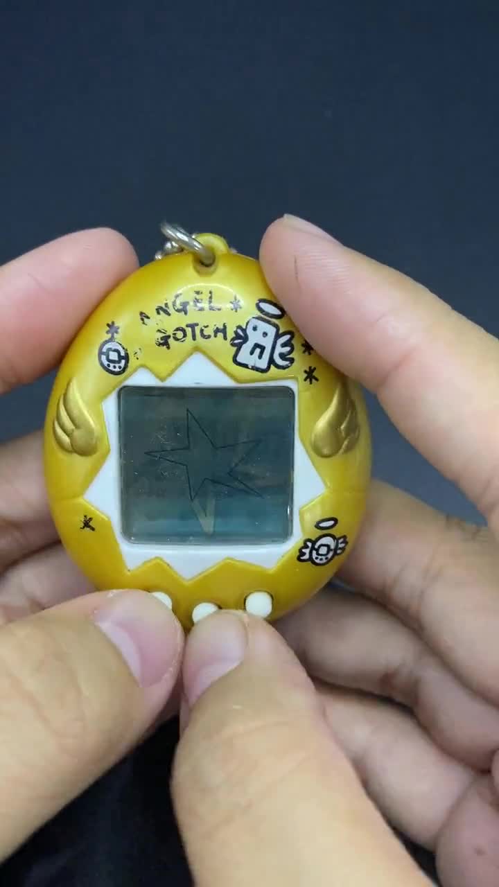 SKU B663P6842 TA8 | Vintage Tamagotchi Angel Yellow With Gold