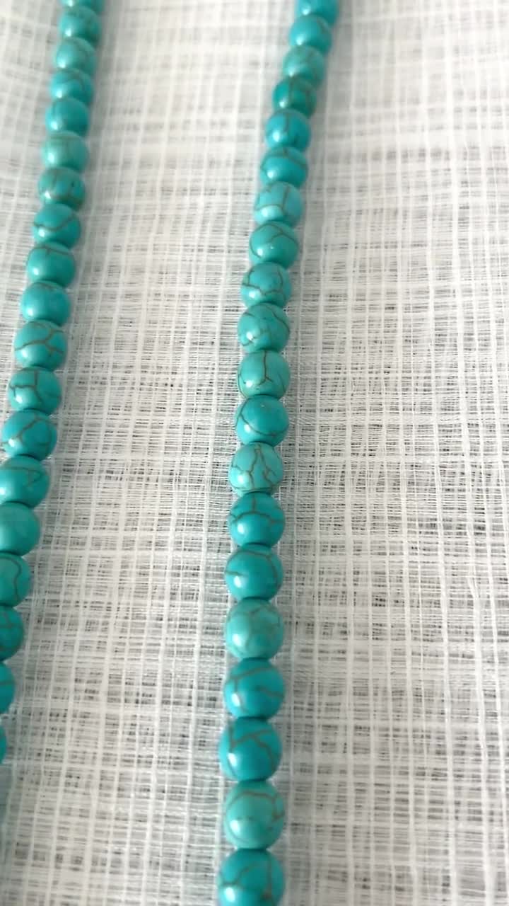 Collana di perle d'acqua dolce annodate a mano con accenti di ametista