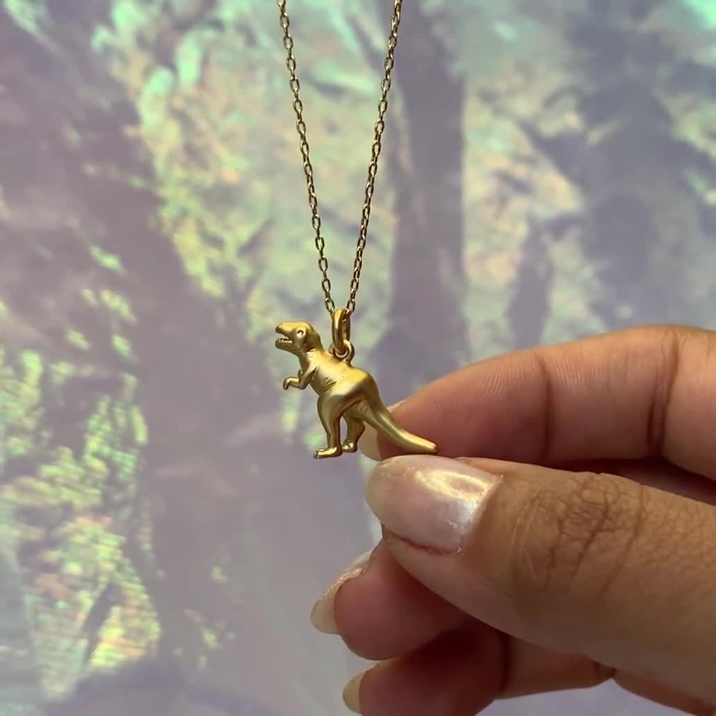 Collana con dinosauro in oro Collana con pendente a forma di