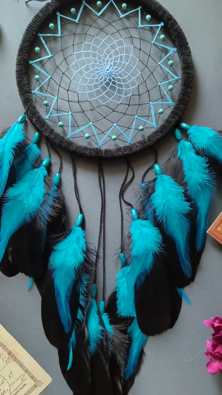 Large black dream catcher with turquoise blue feathers and gemstones.  Native american decor