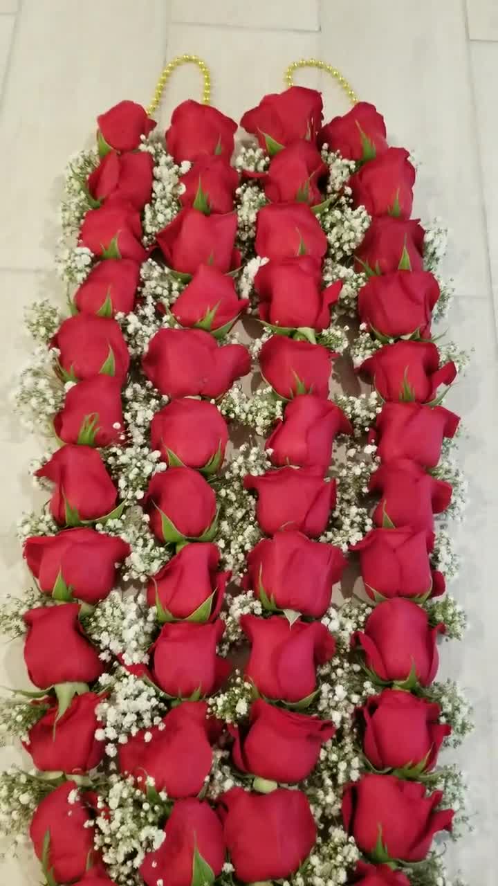 Pink rose with baby breth flower garlands at Rs 4500/pair