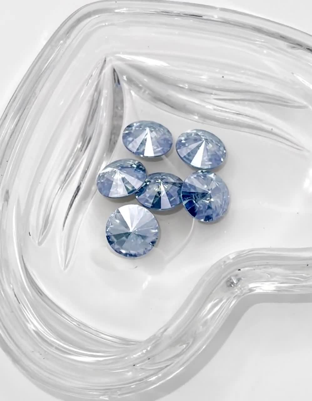 サトニャン。オラフ　SWAROVSKI Una bangle, Clover, Blue, Rhodium plated | Swarovski