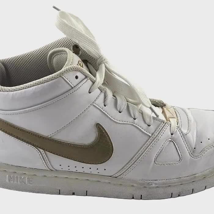 white nike basketball shoes with gold swoosh