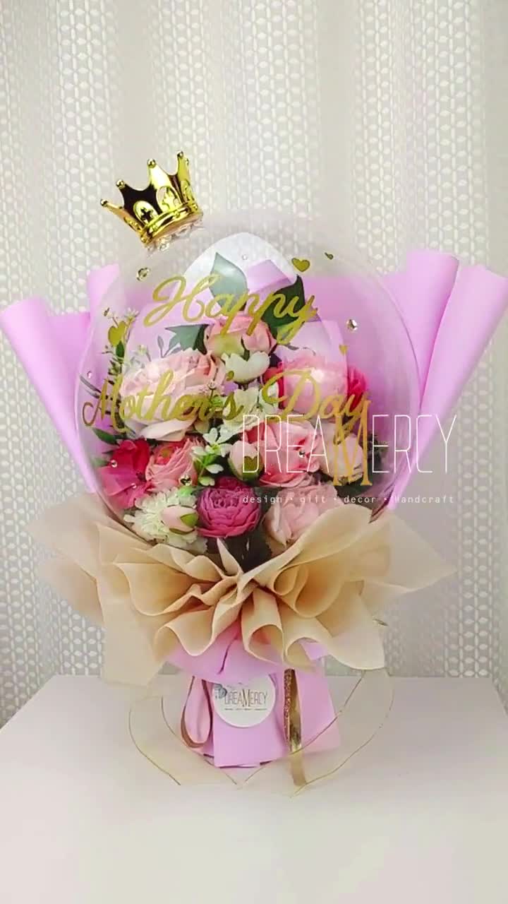 roses, baby breath and greenery with basket in Rockville, MD