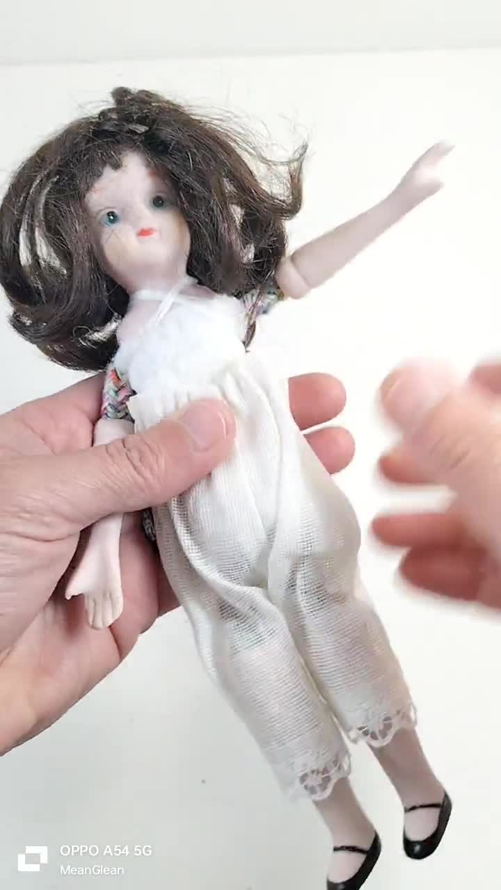 Vintage 8 Inch Bisque China Doll – Flexible Articulated Brunette