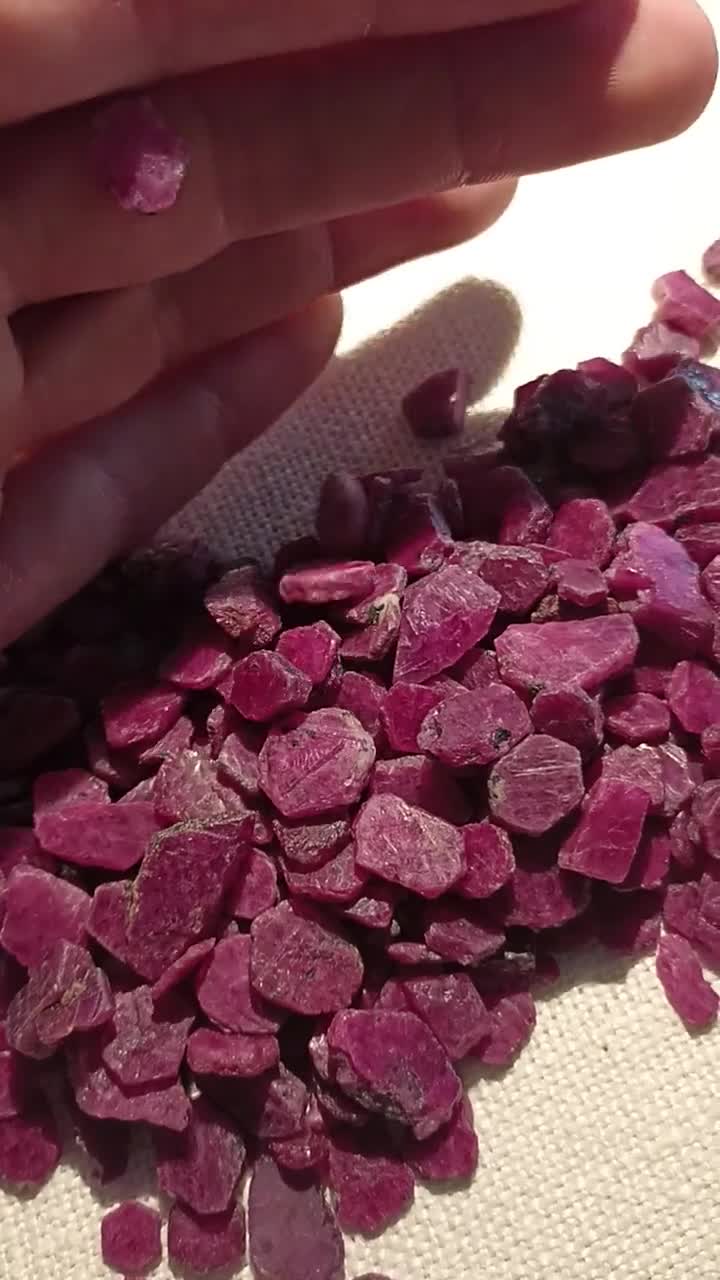 Ruby crystals, small flat translucent ruby crystals, rough stones video poster