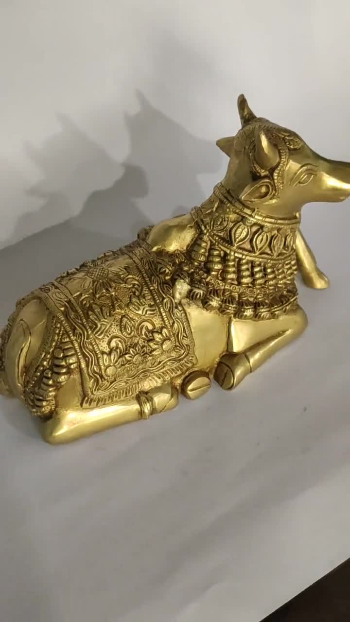 Brass Nandi Statue, Gatekeeper of Shiva & Parvati,10 INCH Sacred Bull god, Sitting Nandi, Shiv Sevak, Cow God For Temple Mandir Shrine Altar video poster
