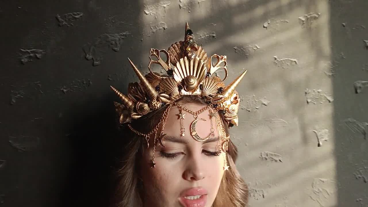 Mermaid headdress shells, gold, red hair, pearls on Craiyon