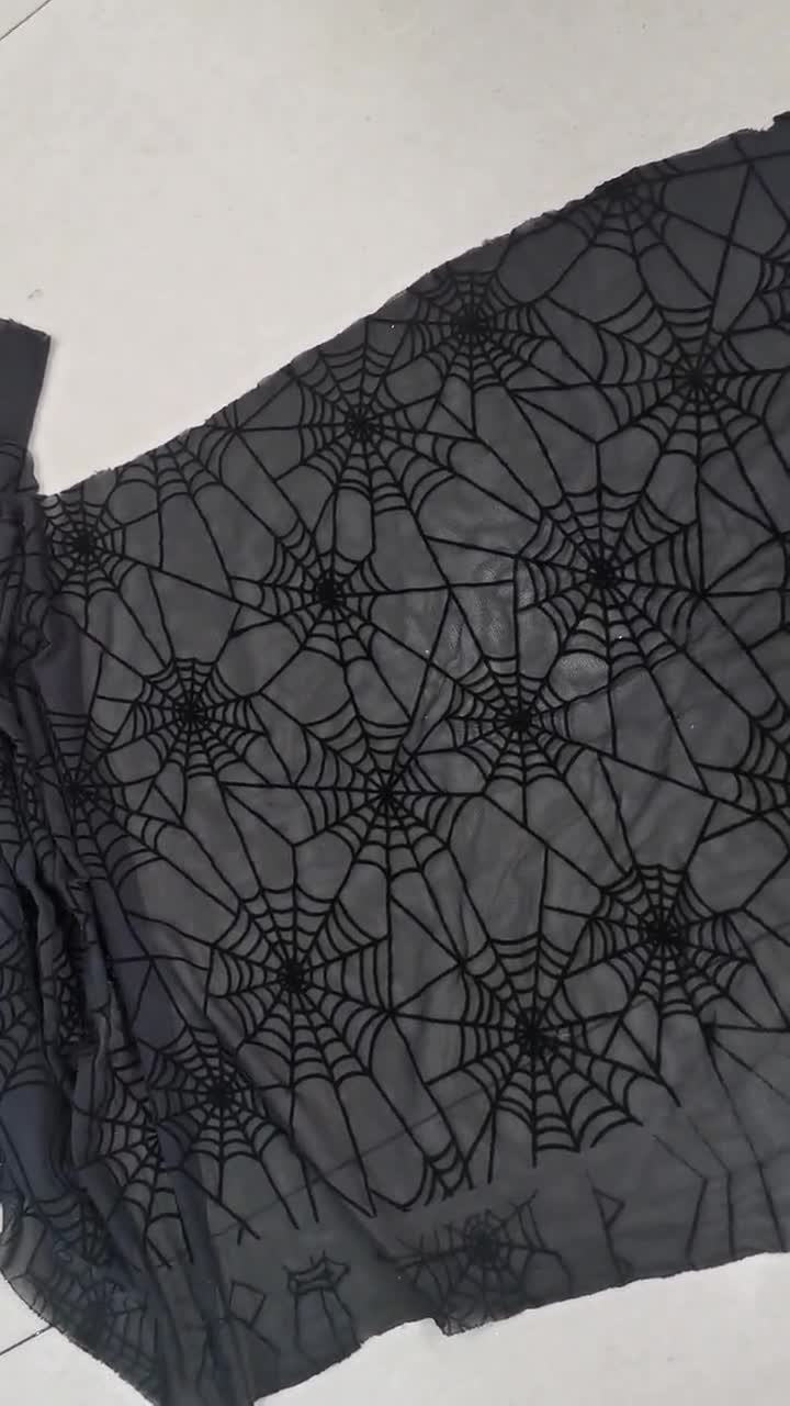 Black Spider Web Flocking on Black Stretch Mesh Fabric