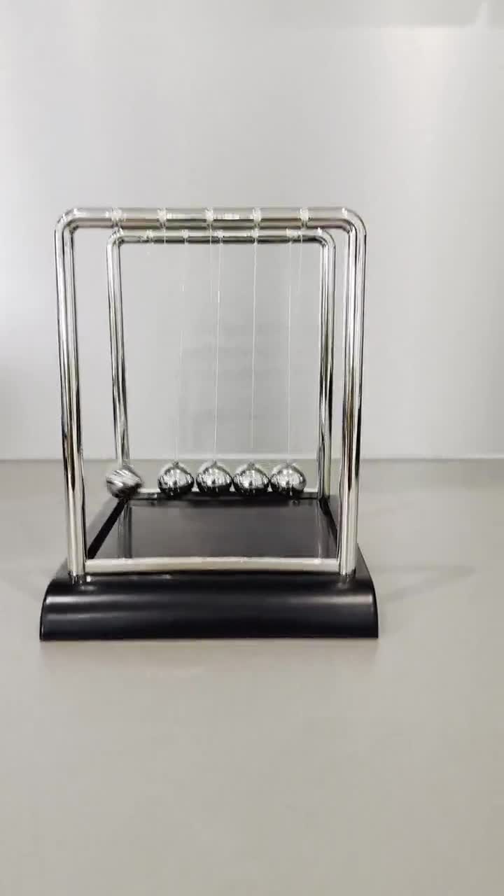 Newtons Cradle Made Of Glass And Stone High-Res Stock Photo - Getty Images