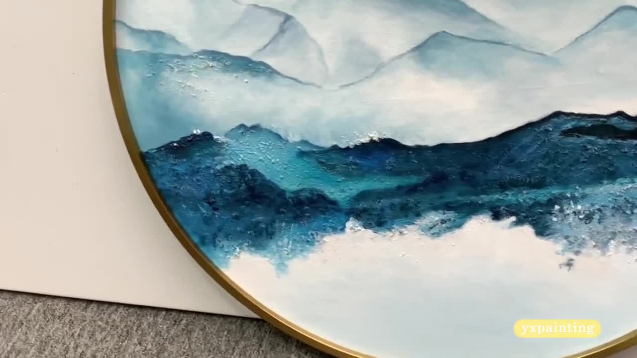 Original Acrylic painting on 100% cotton round shaped canvas. Changing winds and snow orders on mountains , shades of blue and white