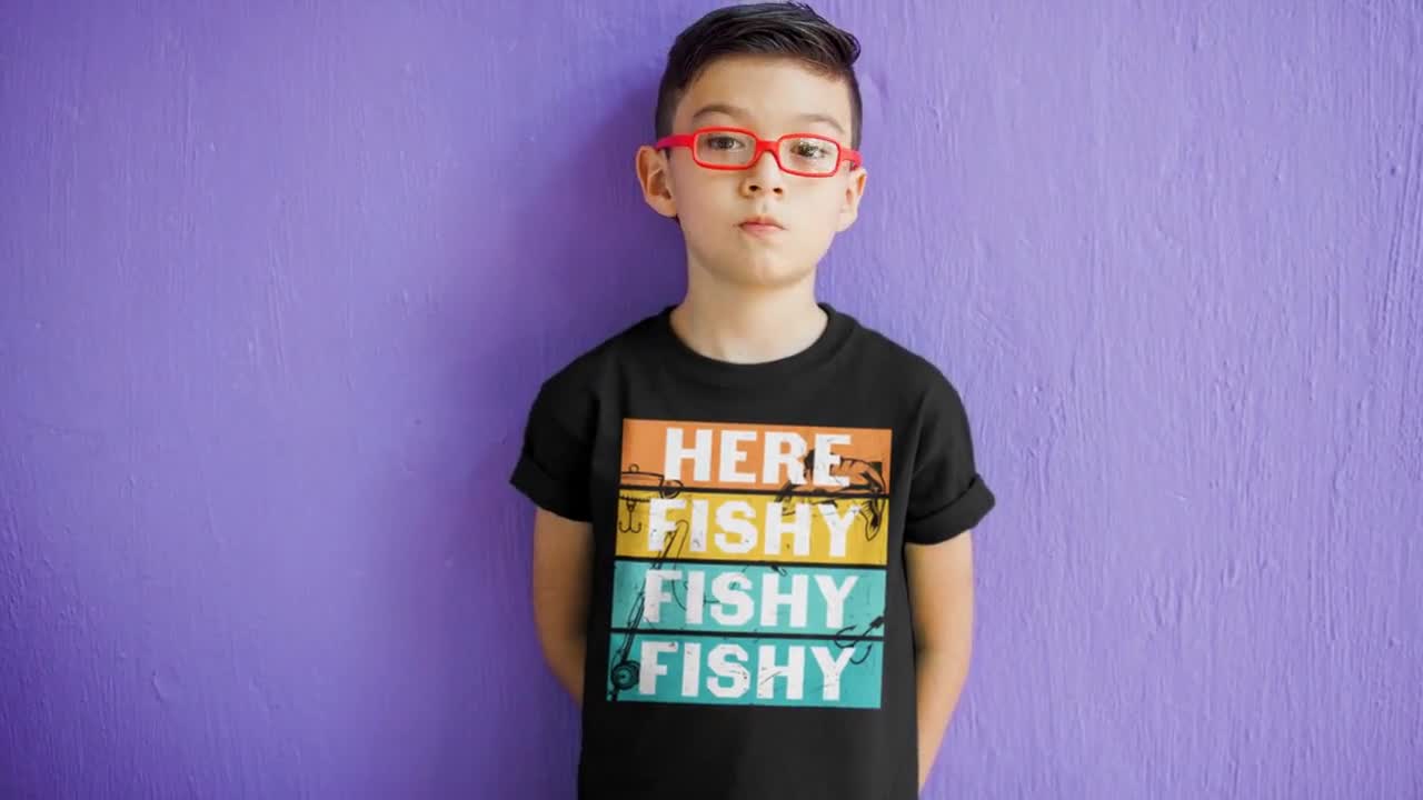 https://v.etsystatic.com/video/upload/q_auto/boy-with-glasses-standing-in-front-of-a-purple-wall-wearing-a-kid-s-tee-video-a12539_wrlj6i.jpg