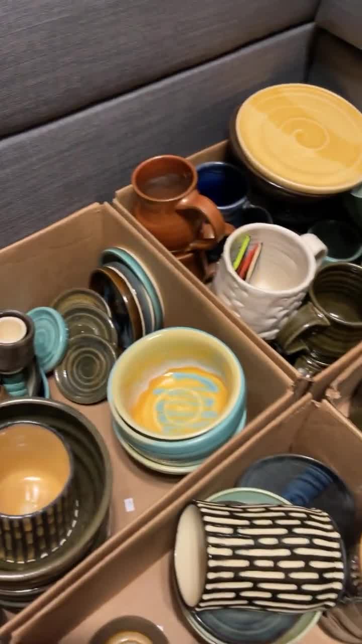 Stack Of Styrofoam Plates Beside Ceramic Plate On Table High-Res