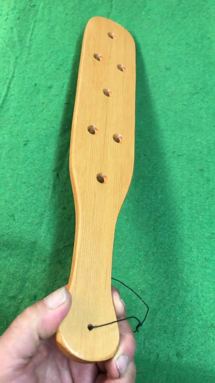 large wooden hand crafted fraternity paddle with holes douglas fir