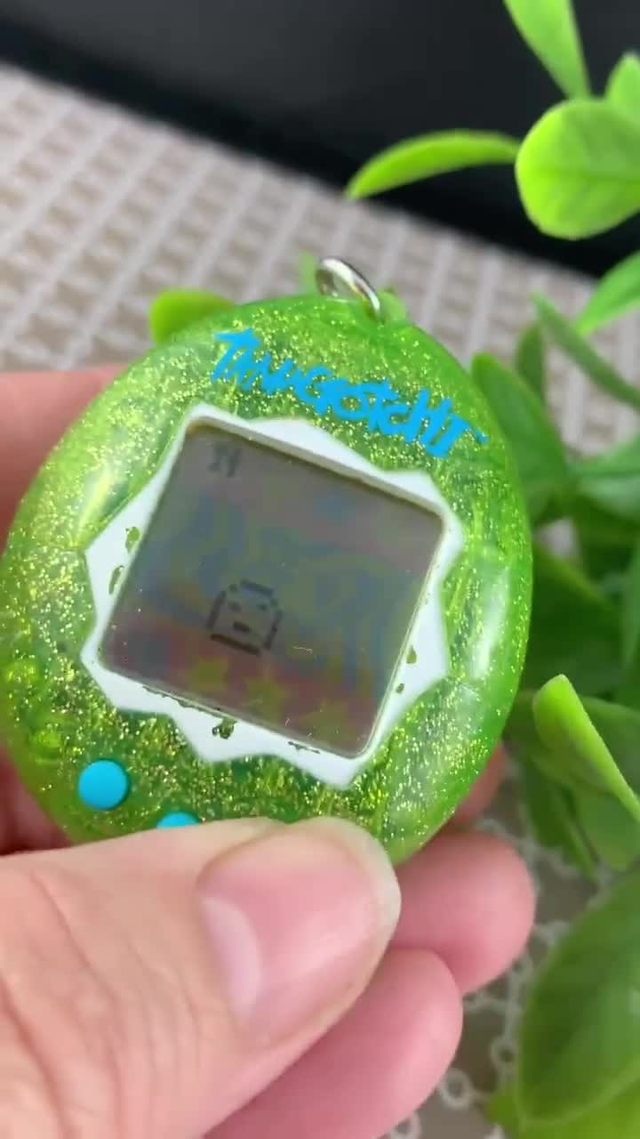 Tamagotchi Electronic Game Bandai RARE Green Glitter Keychain. No