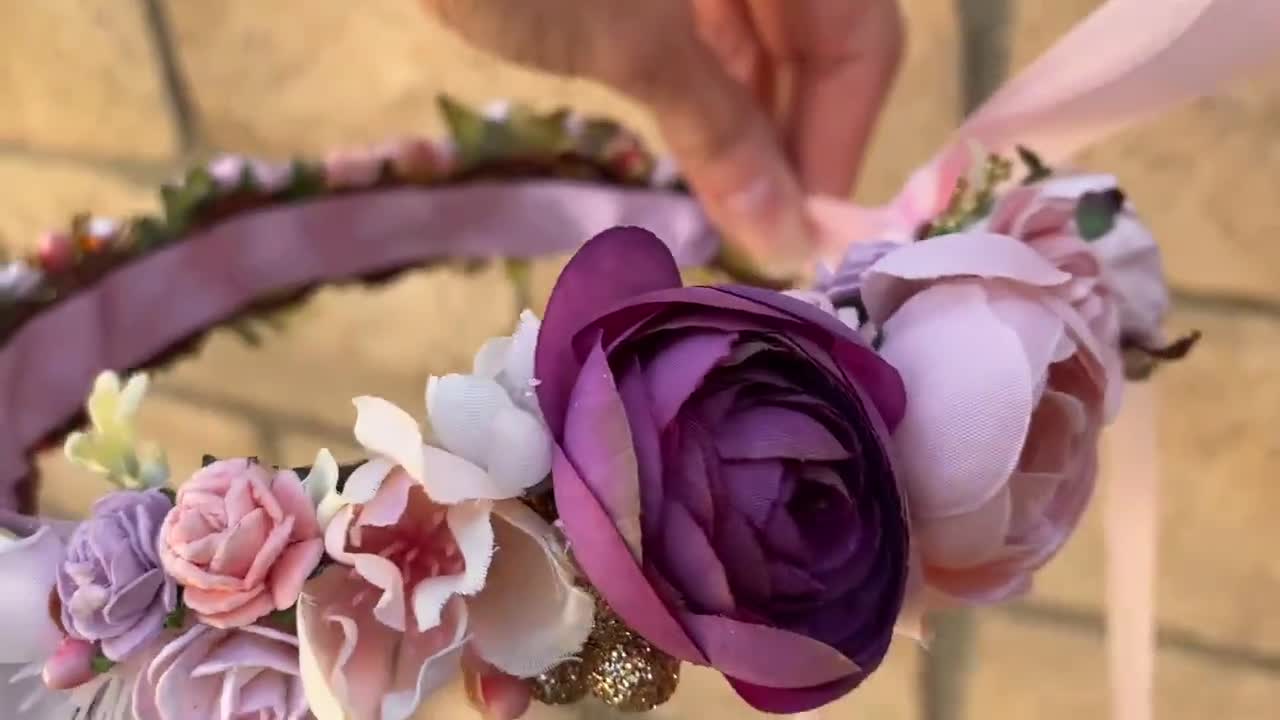 Pink and Purple Rosette Crown, this flower tiara is perfect orders for a special occasion. Vibrant purple and pink adorned with pearls.