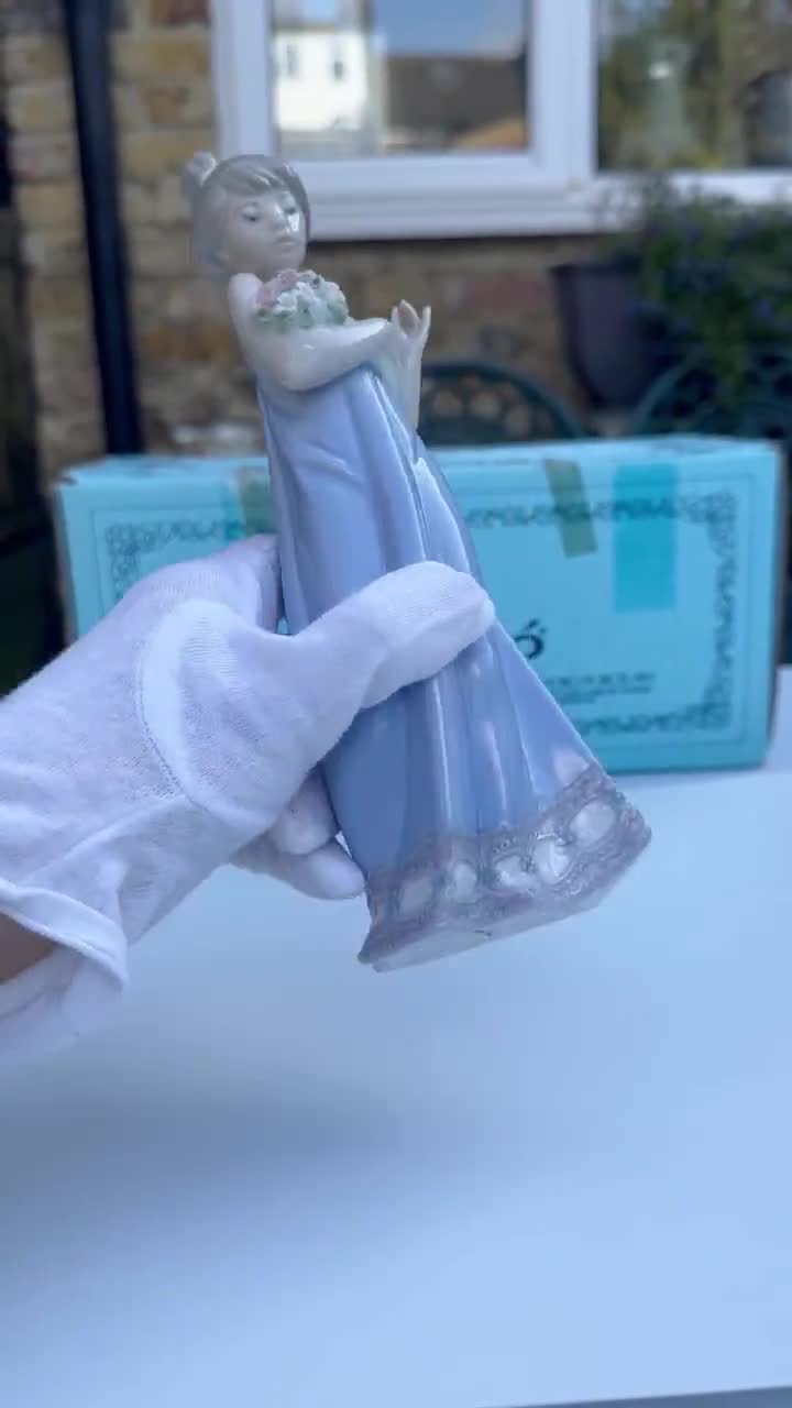 A Signed Lladro 5604 Spring Token Porcelain Figurine of A
