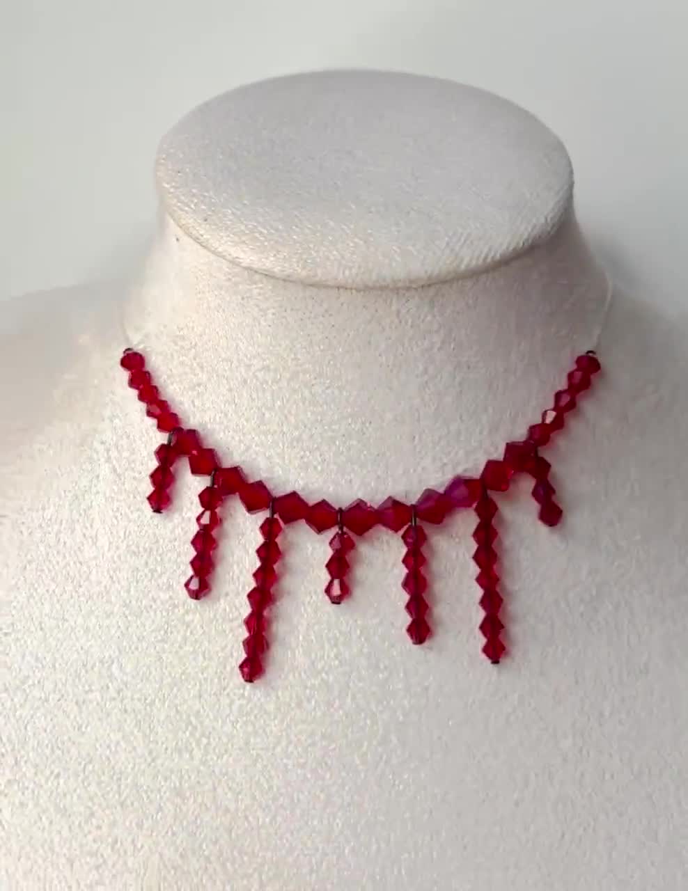 Sliced neck necklace made with red sparkle beads and fishing line