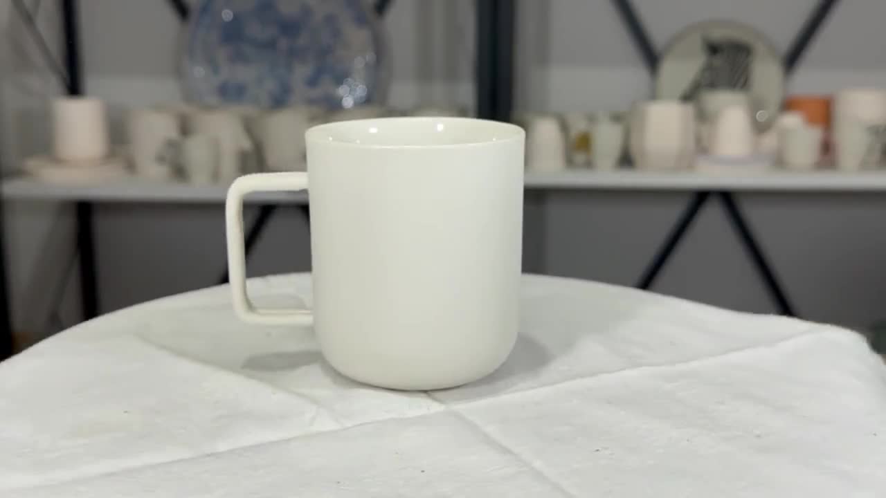 Porcelain coffee mugs with matte white finish · Handmade Ceramic