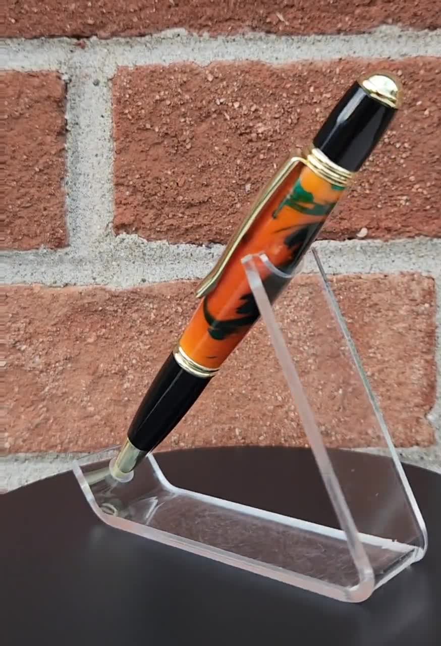 Black White Orange Swirl Pen, Gunmetal Hardware with Gold Trim, 2024 Black Ink, Twist Cap Rollerball Pen