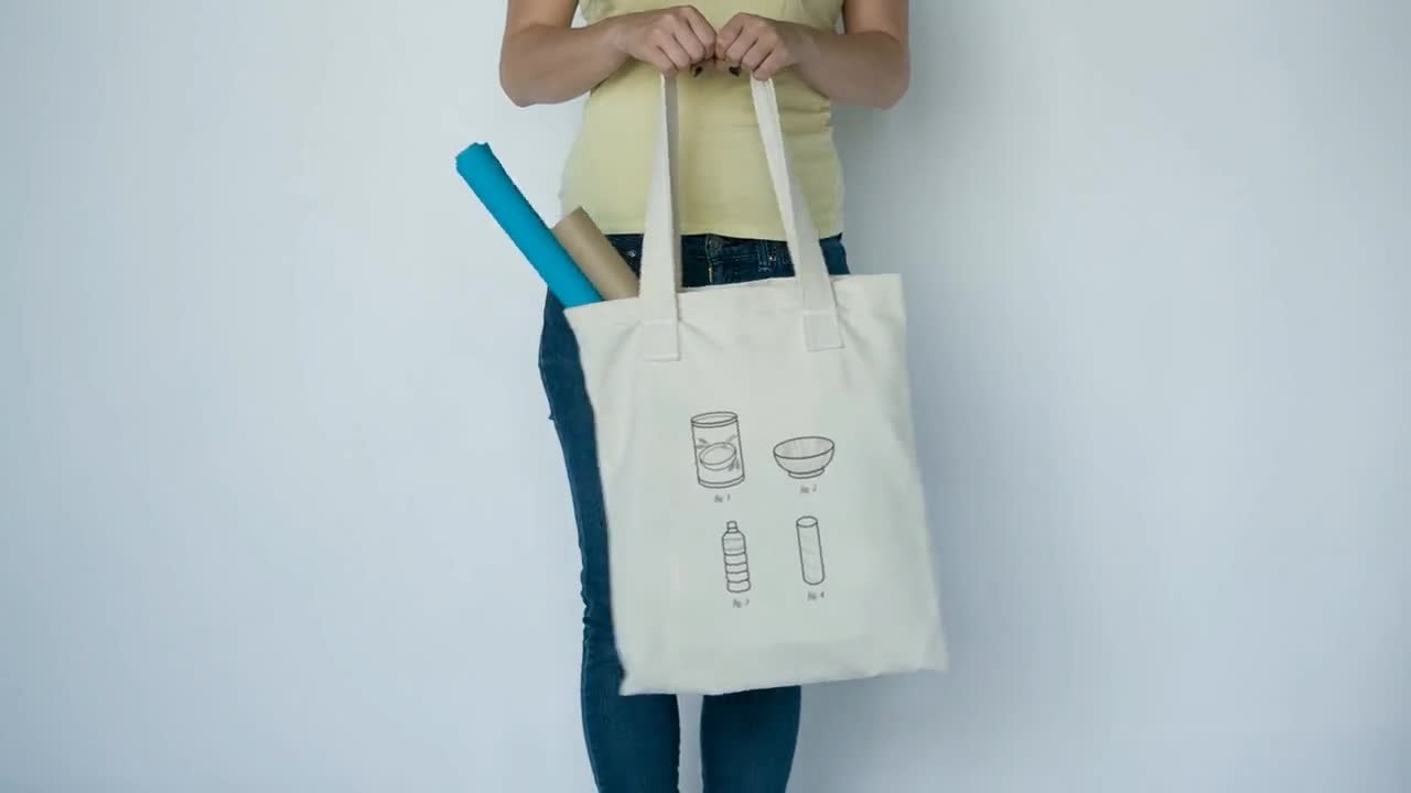 https://v.etsystatic.com/video/upload/q_auto/girl-slightly-swinging-a-tote-bag-standing-against-a-white-wall-video-a13847_l2nmvm.jpg