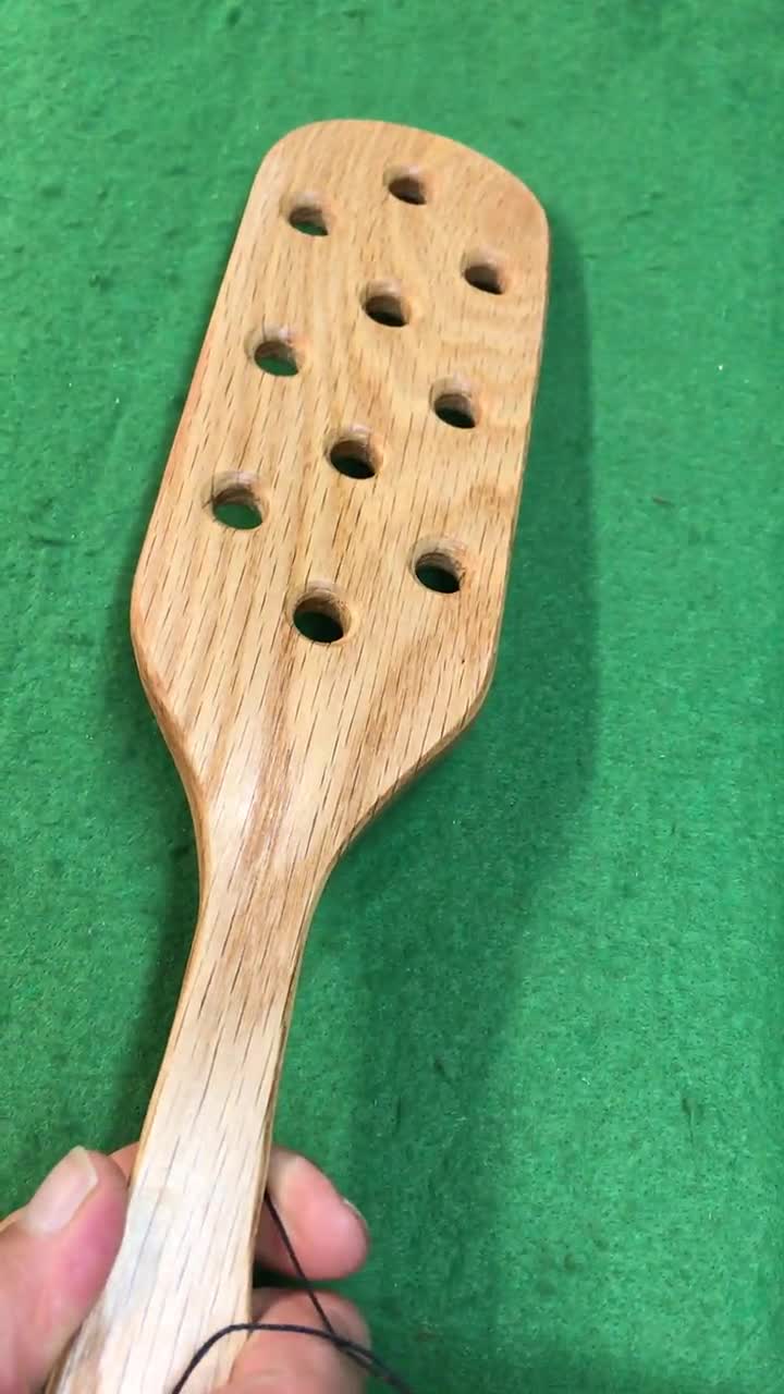 large wooden hand crafted fraternity paddle with holes douglas fir