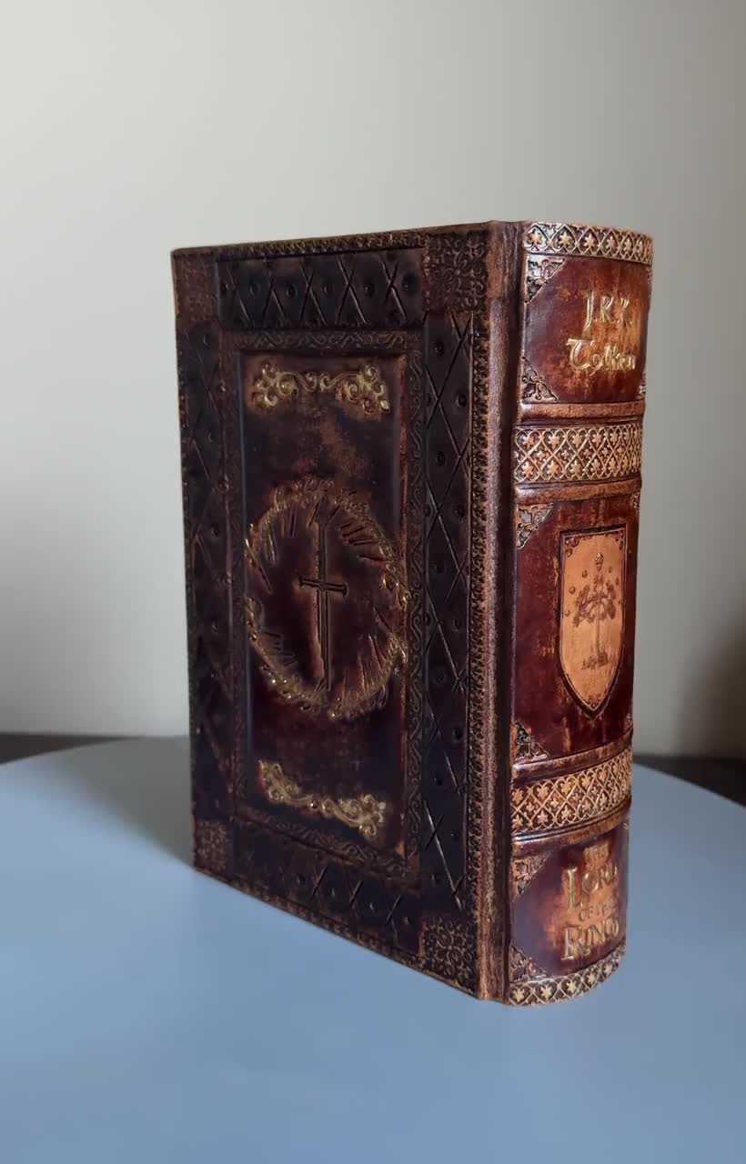 The Lord of the Rings leather book, one-volume collectors edition of Tolkien’s, LOTR books, english version video poster