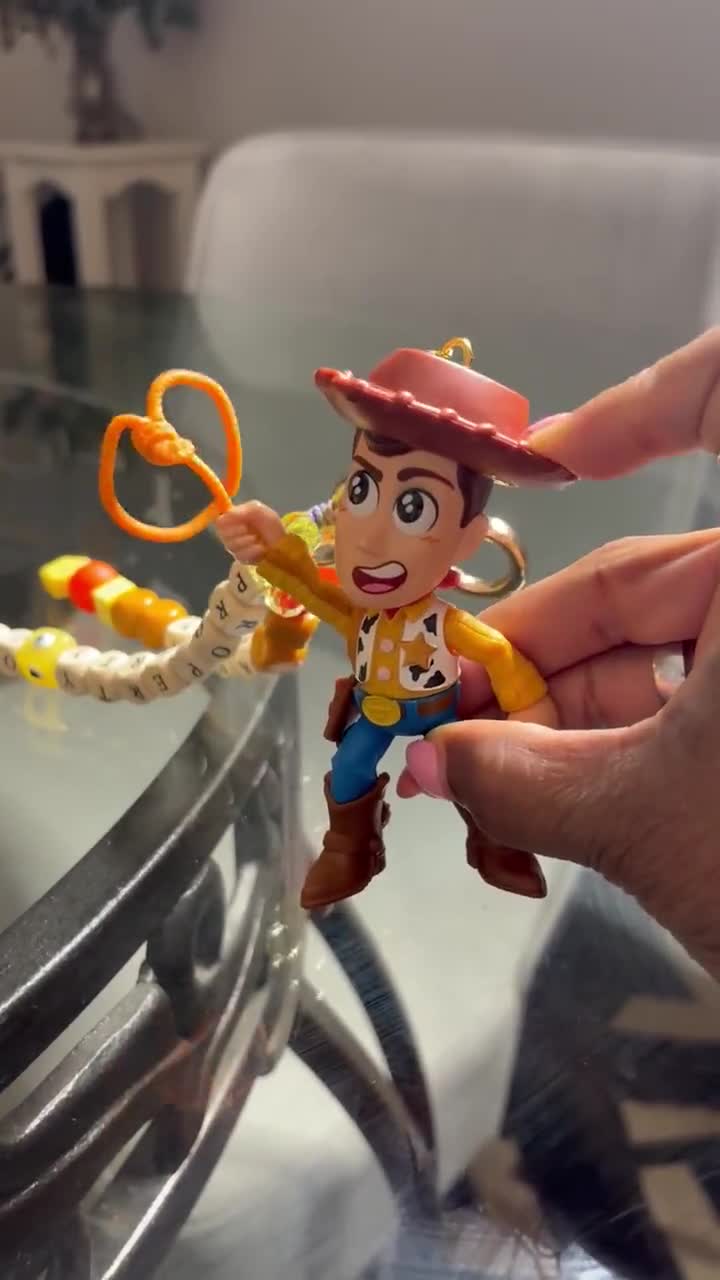 Sheriff Woody Bag Charm: Interactive Toy Story Keychain with Twirling Lasso video poster