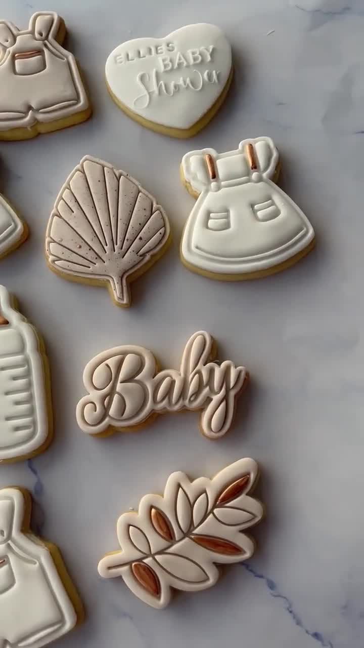 White, nude and gold baby shower cookie favours