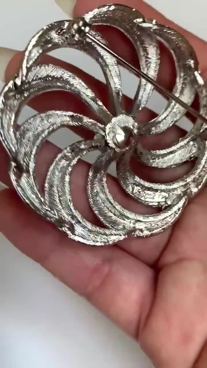 Spilla vintage a girandola Roget in metallo color argento -  Italia