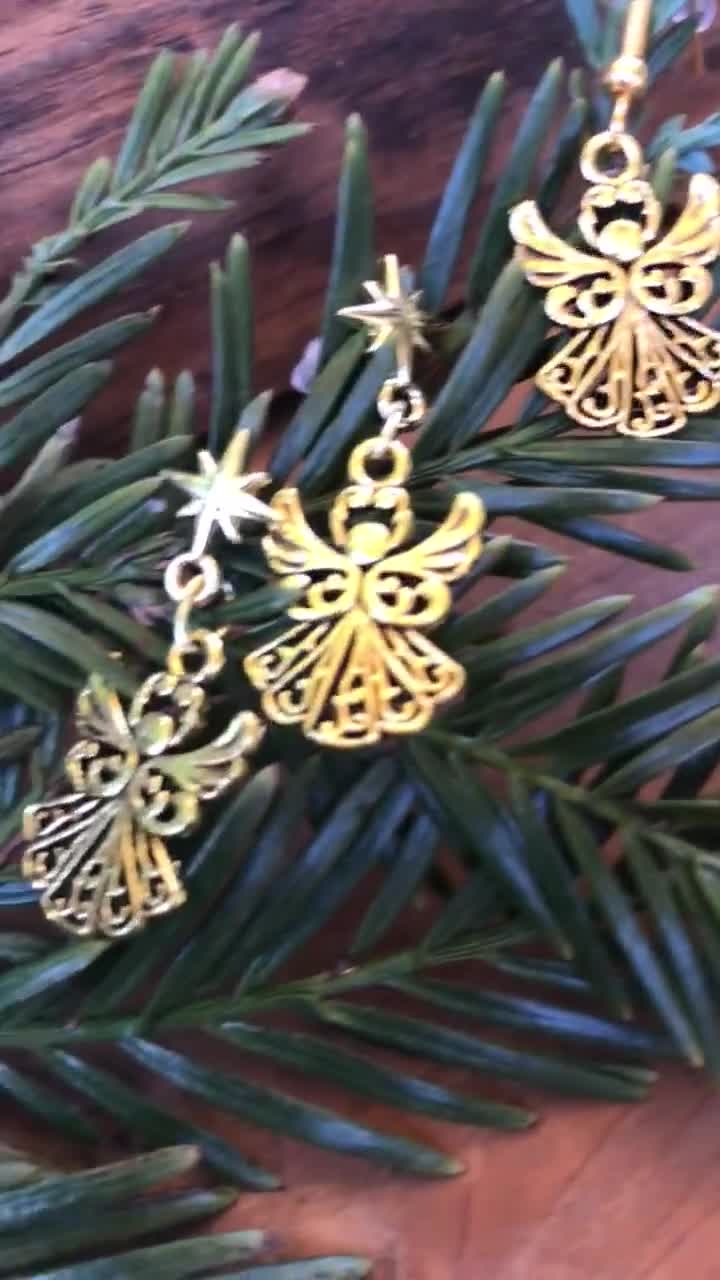 Pendientes colgantes de ángel con postes de estrella dorada o ganchos para la oreja video poster