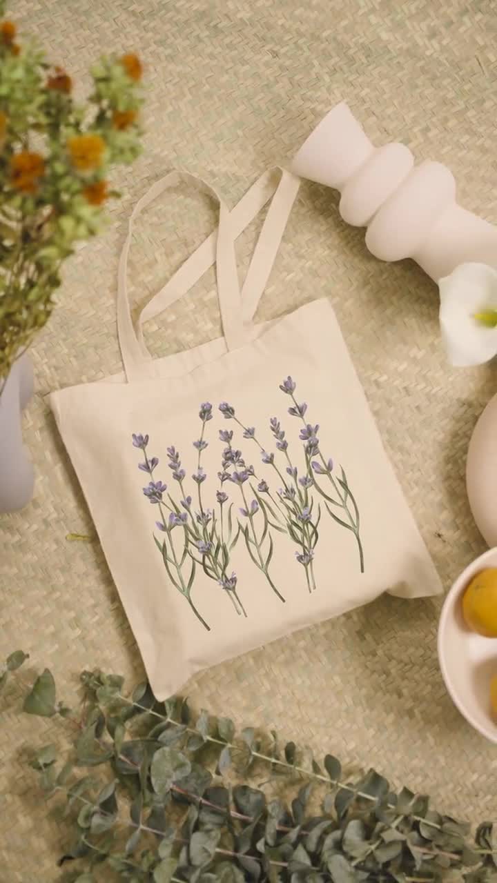 https://v.etsystatic.com/video/upload/q_auto/video-featuring-a-tote-bag-surrounded-by-modern-ceramic-vases-and-plants-5032v_fuuvr2.jpg