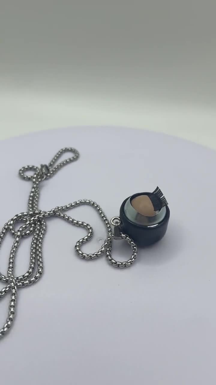 点滅するドールアイネックレス：動く目、ステンレススチール、21mm